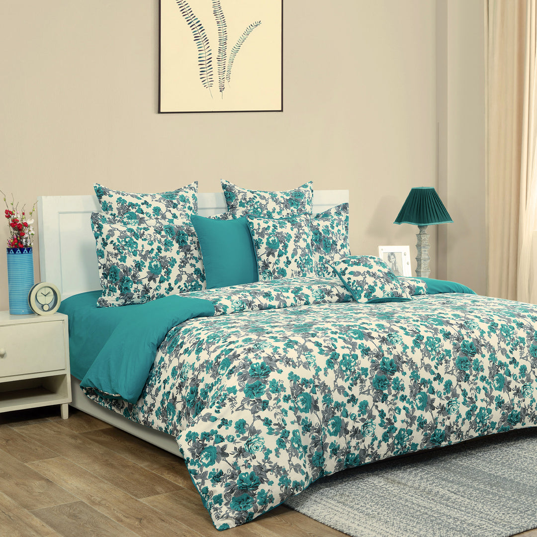 Floral cotton bedsheet set, 200TC bedding, multicolour bed linens, teal and white bedroom design, large pattern sheets, botanical bedspread, vibrant cotton comfort, garden-inspired duvet cover, bright floral textiles, luxury cotton sleep, nature-themed bedroom style, teal bloom pattern.