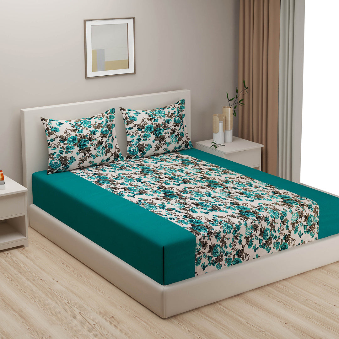 Floral cotton bedsheet set, 200TC bedding, multicolour bed linens, teal and white bedroom design, large pattern sheets, botanical bedspread, vibrant cotton comfort, garden-inspired duvet cover, bright floral textiles, luxury cotton sleep, nature-themed bedroom style, teal bloom pattern.