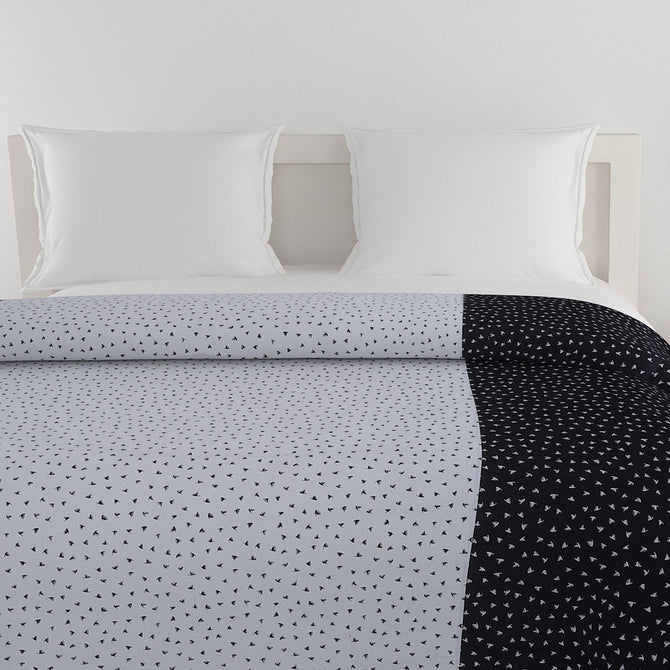 Geometric bird print bedsheet set, 200TC cotton bedding, black and white bedroom design, abstract pattern sheets, modern duo-tone linens, contemporary avian design, small pattern bedspread, complementary bedsheet set, stylish geometric decor, luxury cotton bed set, artistic bird motif, minimalistic bedroom style.