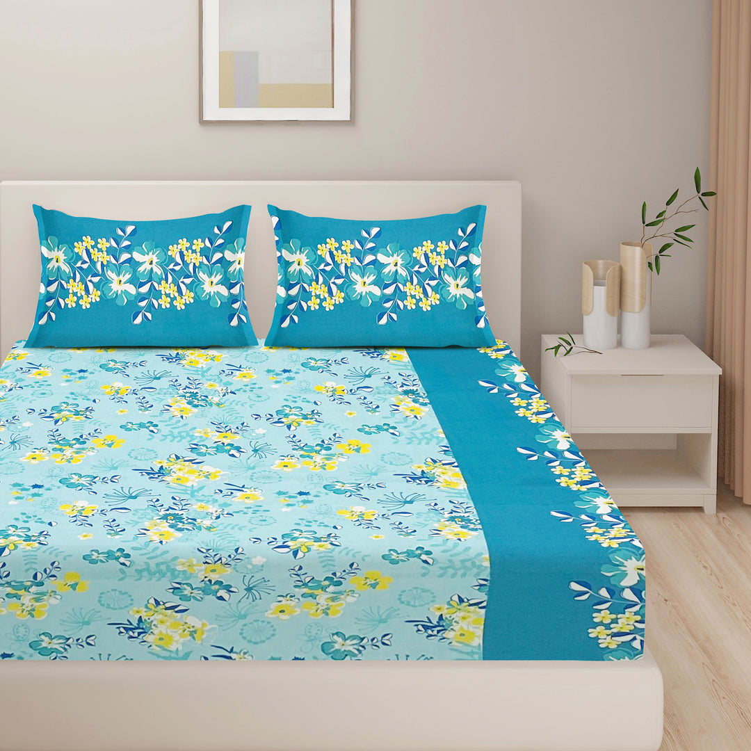 bright floral bedding, 120TC cotton bedsheet, vibrant garden bedroom decor, aqua blue bedding, fresh botanical bedspread, soft comfortable bedding, premium cotton bedding, lively bedroom textiles, cheerful nature-inspired bed linen, colorful floral patterns