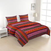 Ethnic cotton bedsheet, 200 thread count, vibrant bed linen, bohemian bedroom decor, artisanal bedding, mix and match patterns, gemstone hues bedspread, red orange green blue bedding, multicultural design, small print textiles, handcrafted look, pure cotton comfort, bright bedroom aesthetics, eclectic home style.