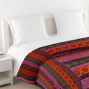 Ethnic cotton bedsheet, 200 thread count, vibrant bed linen, bohemian bedroom decor, artisanal bedding, mix and match patterns, gemstone hues bedspread, red orange green blue bedding, multicultural design, small print textiles, handcrafted look, pure cotton comfort, bright bedroom aesthetics, eclectic home style.