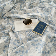 Sugar apple dreams bedding, 160 thread count, 100% cotton floral sheets, blue blossom bedding set, brown orchard comforter, cream floral pattern, muted color textiles, earthy bedroom design, soft cotton duvet cover, natural hypoallergenic material, comfortable and durable bed linens, serene sleep experience, contemporary bedroom decor, country style bedding, organic elegance, rich brown and cream hues, breathable fabric, cool and calming sleep environment, sugar apple inspired patterns